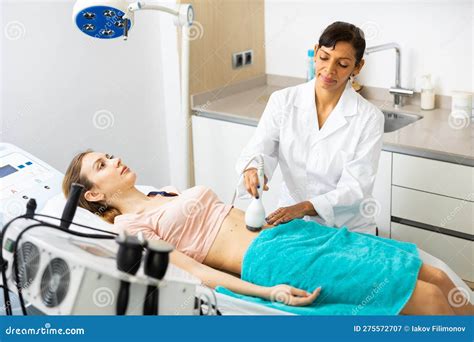 Woman Cosmetologist Making Ultrasound Lifting Procedure Stock Image