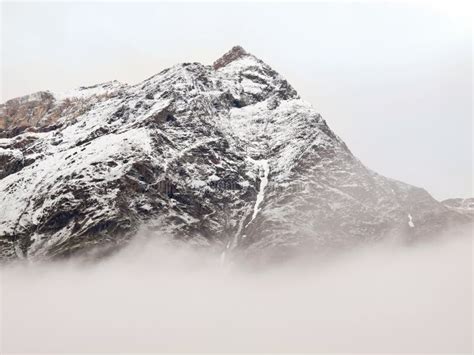 Sharp Snowy Peaks Alps Mountains Above Valley Full Heavy Grey Fog Stock