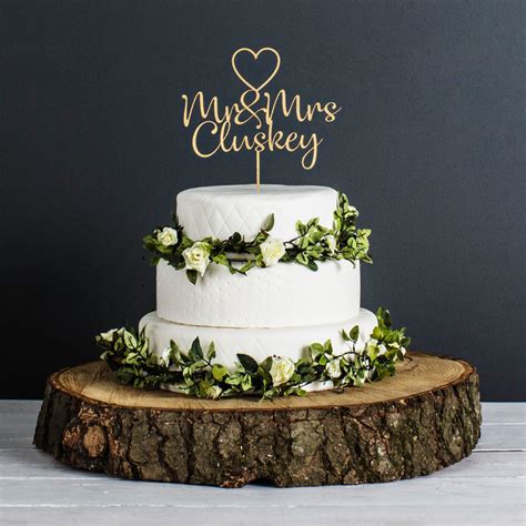 Add the perfect finishing touch to your special dessert. Personalised Wedding Cake Topper in a gold finish from ...