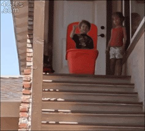 A Kid Is Sealed In A Plastic Bin And Pushed Down Stairs Gif Primogif