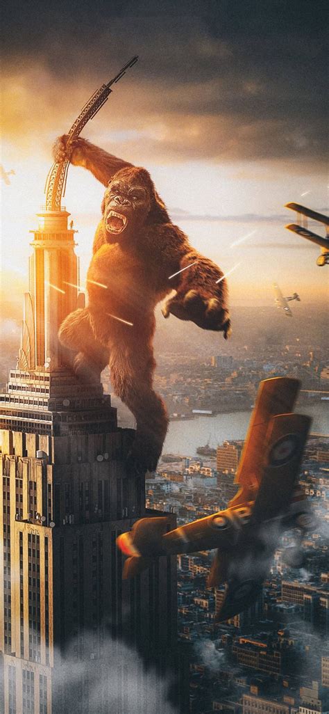 Downloaden Dasempire State Building Steht Resolut Während Godzilla Und