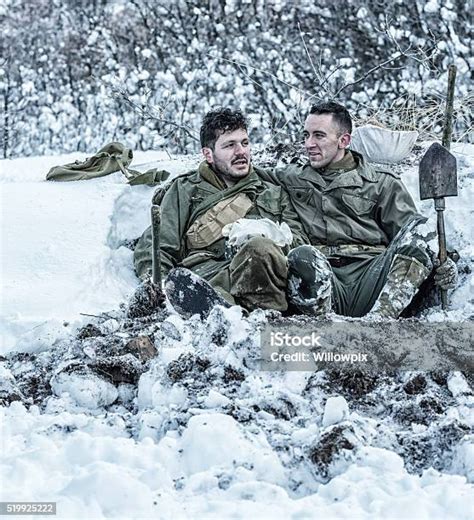 Wwii Us Army Soldier Buddies Relaxing Talking In Foxhole Stock Photo