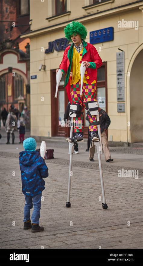 Colorfully Dressed Clown On Stilts Wroclaw Old Market Stock Photo Alamy