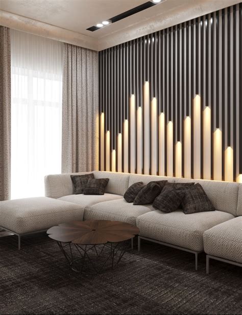 A Modern Living Room With White Couches And Candles On The Wall