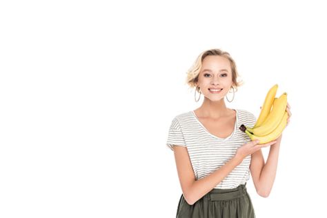 Woman Holding Fresh Ripe Bananas And Smiling At Camera Stock Photo
