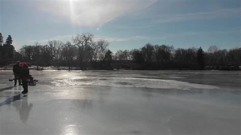 Premium Stock Video Ice Fishers On A Frozen Lake Afternoon