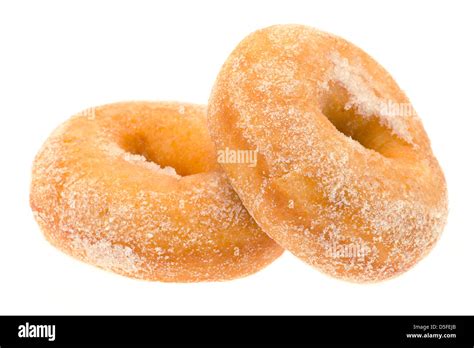 Two Sugar Coated Ring Donuts Studio Shot With A White Background