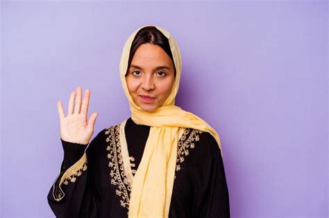 Premium Photo Young Arab Woman Wearing A Typical Arabian Costume Isolated On Purple Background