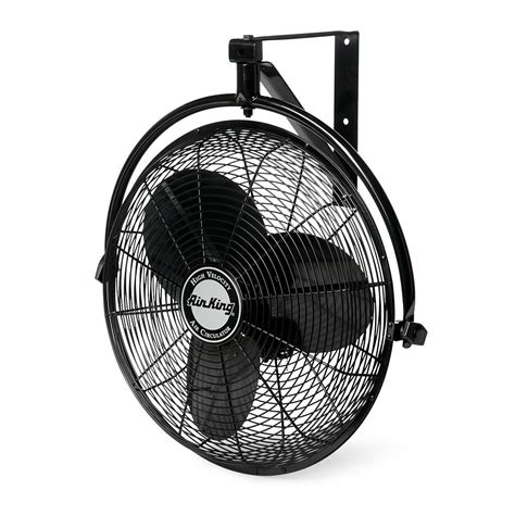 A Black Fan Sitting On Top Of A Metal Stand