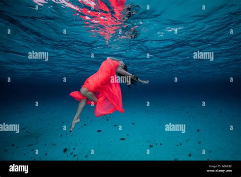 Woman Underwater In Red Dress Stock Photo 105494354 Alamy