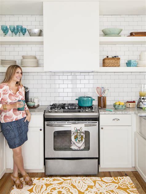 For contrast, she chose an emerald green tone from the wallpaper to paint the kitchen's island. White Kitchen Cabinets: Pictures, Ideas & Tips From HGTV ...