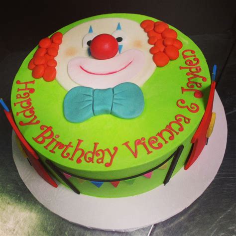 Circus Theme Cake With A Handmade Clown Face And Circus Tent On The Sides City Cakes
