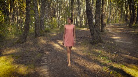 Young Girl In A Pink Dress Is Walking In The Woods Stock Video Footage
