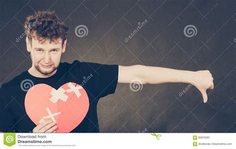 Sad Man With Glued Heart By Plaster Royalty Free Stock Image