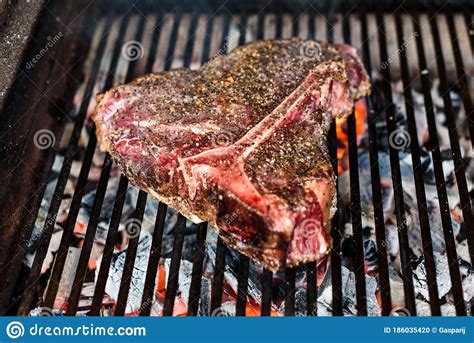 The process of grilling t bone steaks should be familiar for those who are used to grilling meats. Grilling Big T Bone Steak On Natural Charcoal Barbecue Grill Stock Photo - Image of closeup ...