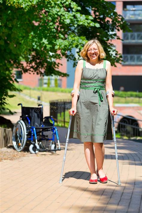 Woman Practicing Walking On Crutches Stock Image Image Of Practicing