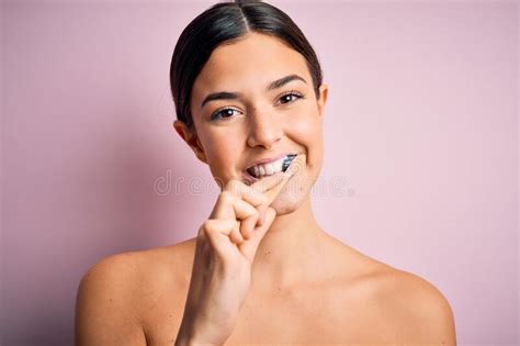 Young Beautiful Brunette Woman Brushing Her Teeth Using Tooth Brush And