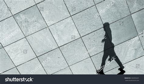 Shadow Of A Man Walking Stock Photo 392055241 Shutterstock