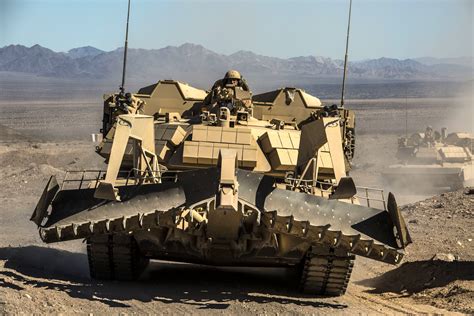 An Assault Breacher Vehicle Races Towards The Objective As Artillery