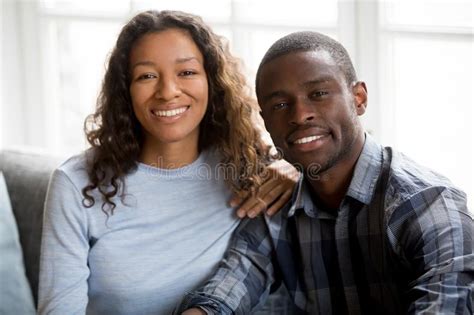 Portrait Of Happy Mixed Race Couple Posing For Picture Stock Photo