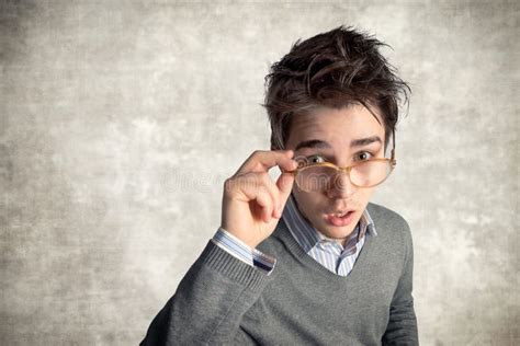 Young Perplexed Man In Casual Clothes Posing Isolated On Blue Wall