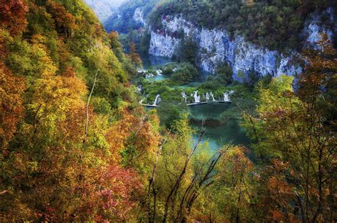 Croatia Scenic View Of Lake Surrounded By Autumn Forest In Plitvice