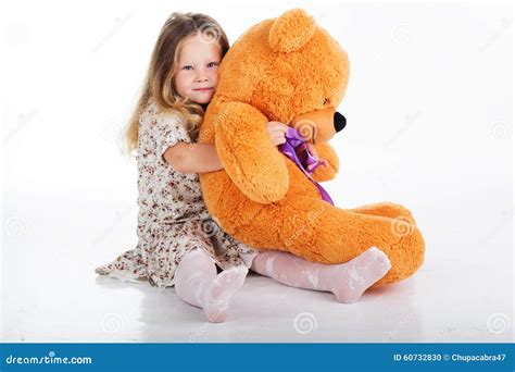 Child Girl Is Holding Her Teddy Bear Stock Photo Image Of Expression