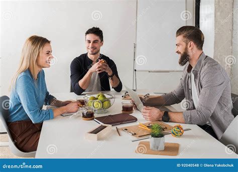Cheerful Co Workers Doing Their Job Together Stock Photo Image Of