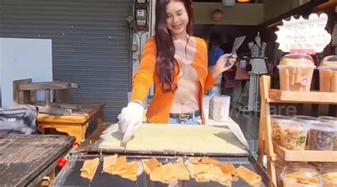 Thai Pancake Seller Grilled By Police Over Cleavage Revealing Cardigans That Attracted Customers