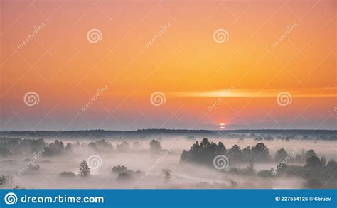 Amazing Sunrise Over Misty Landscape Scenic View Of Foggy Morning Sky