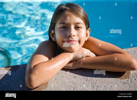 Beautiful Little Latin Girl In A Bathing Suit In The Pool Stock Photo