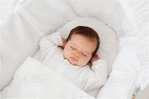 Baby Sleeping In A Bassinet Stock Photo Dissolve