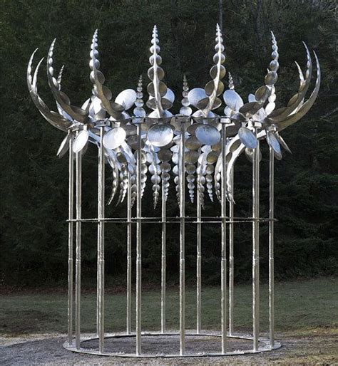 A Kinetic Sculpture Composed Of Many Plates Of Stainless Steel Wind