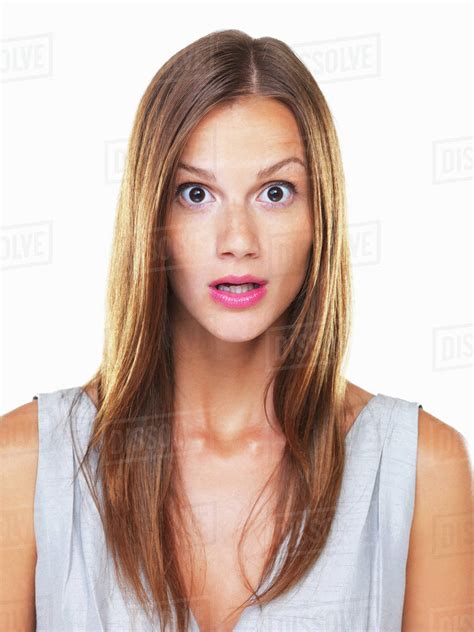 Studio Portrait Of Young Surprised Woman Staring On Camera Stock
