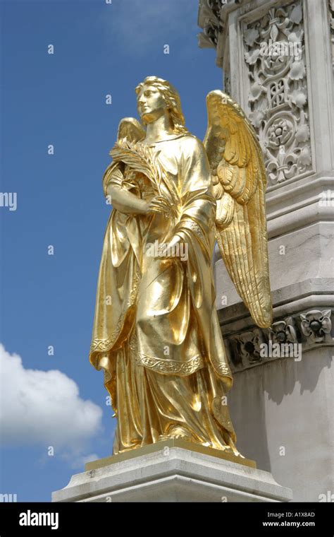 Angel At The Base Of The Virgin Mary Statue Outside The Cathedral Of