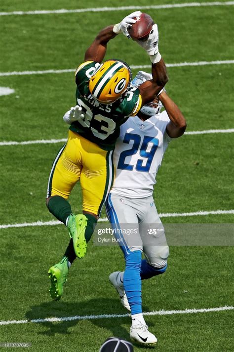 Aaron Jones Of The Green Bay Packers Makes A Catch While Being