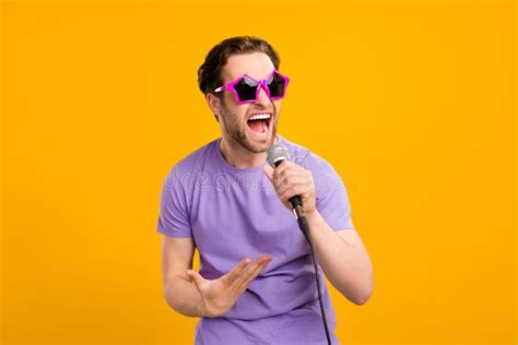 Photo Of Crazy Superstar Singer Guy Hold Mic Sing Wear Sunglass Violet