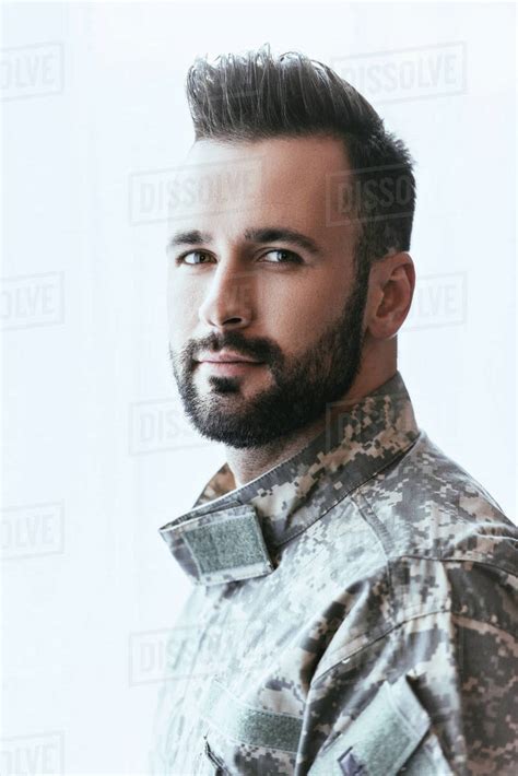 Close Up Portrait Of Army Man In Military Uniform Looking At Camera