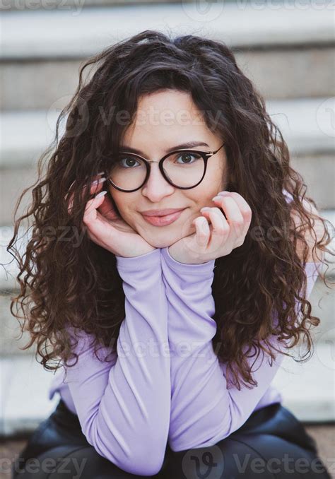 Beautiful Young Woman With Brunette Curly Hair Portrait In Eye Glasses Enjoying The Sun In The