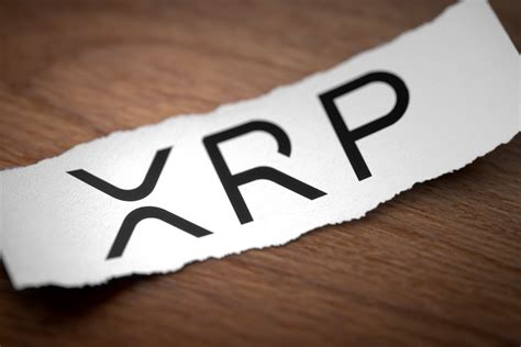 Enabling the internet of value. XRP logo on torn scrap of paper free image download