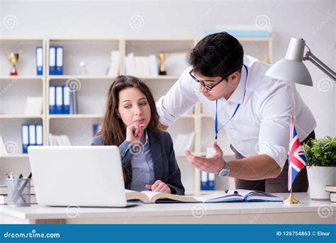 The Teacher Explaining To Student At Language Training Stock Image