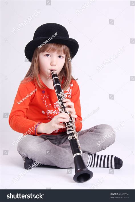 Little Girl Playing On Clarinet Stock Photo 69526534