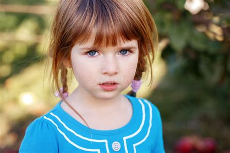 Closeup Portrait Of Cute Adorable Little Red Haired Caucasian Girl