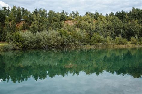 Lake With Turquoise Water And Green Forest Stock Photo Image Of