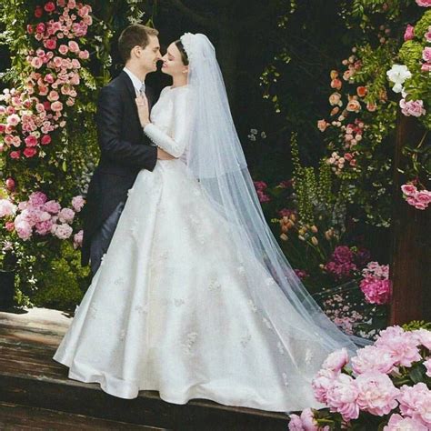 So she teamed up with christian dior's creative director maria grazia chiuri, who created an ivory custom made haute couture gown, hand embroidered with lily of the valley. Miranda Kerr and Evan Spiegel | Dior wedding dresses ...