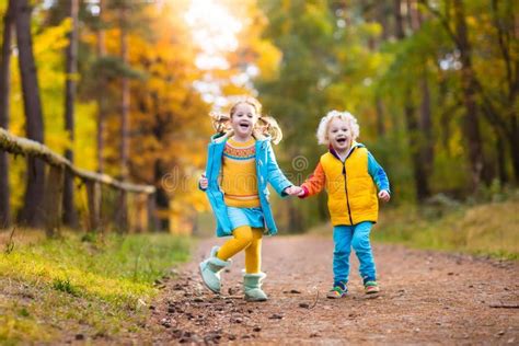 Kids Play In Autumn Park Children In Fall Stock Image Image Of