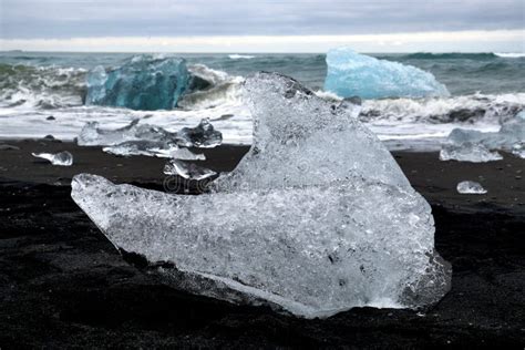 Iceberg On Black Sand Beach Glacier Lagoon Iceland Stock Photo