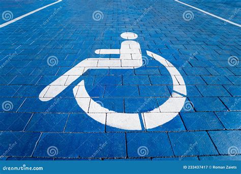 Handicapped Symbol Painted On A Special Parking Space For Disabled