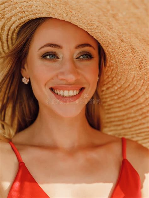 Portrait Of Young Attractive Woman In Bikini With Big Straw Smiling