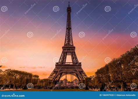 Eiffel Tower In Paris At Dusk With Sky Of Various Colors Stock Photo
